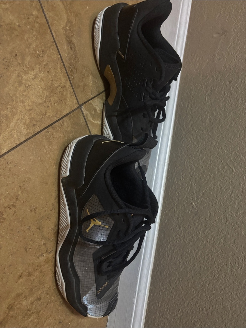 Jordan Black and Gold Low-Top Trainers